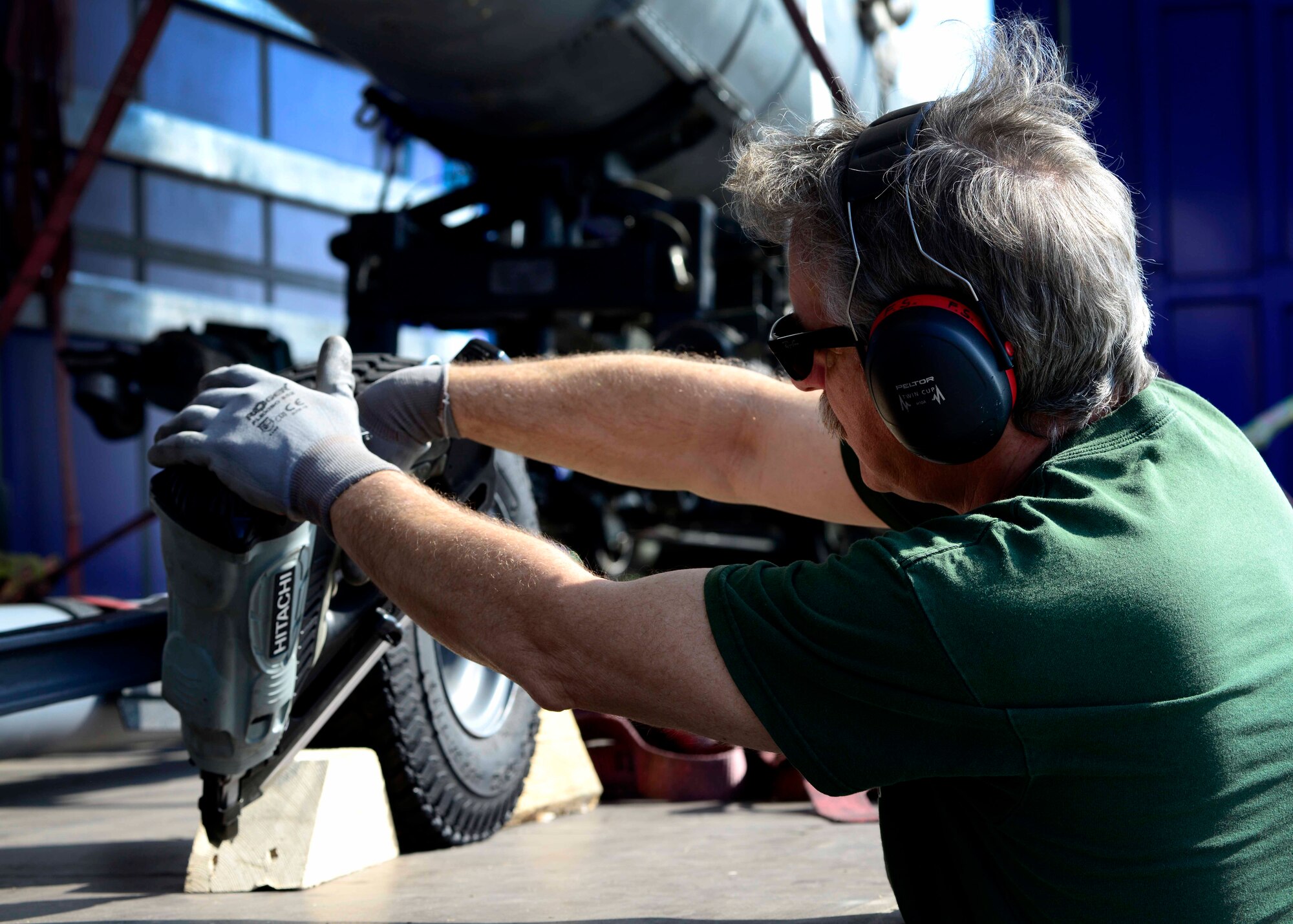 Stefano Festa, 31st Logistics Readiness Squadron traffic management office packer, secures cargo, May 12, 2015, at Aviano Air Base, Italy. Cargo is secured to ensure safe transportation between different locations. (U.S. Air Force Senior Airman Areca T. Wilson/Released)