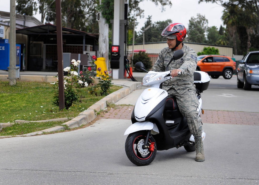 Tech. Sgt. Richard Villa-Ignacio, 39th Logistics Readiness Squadron NCO in-charge of inventory section, rides on a moped May 1, 2015, at Incirlik Air Base, Turkey. Many patrons of Incirlik choose to ride electric bikes or mopeds around base an alternative to walking or driving cars. (U.S. Air Force photo by Senior Airman Krystal Ardrey/Released)