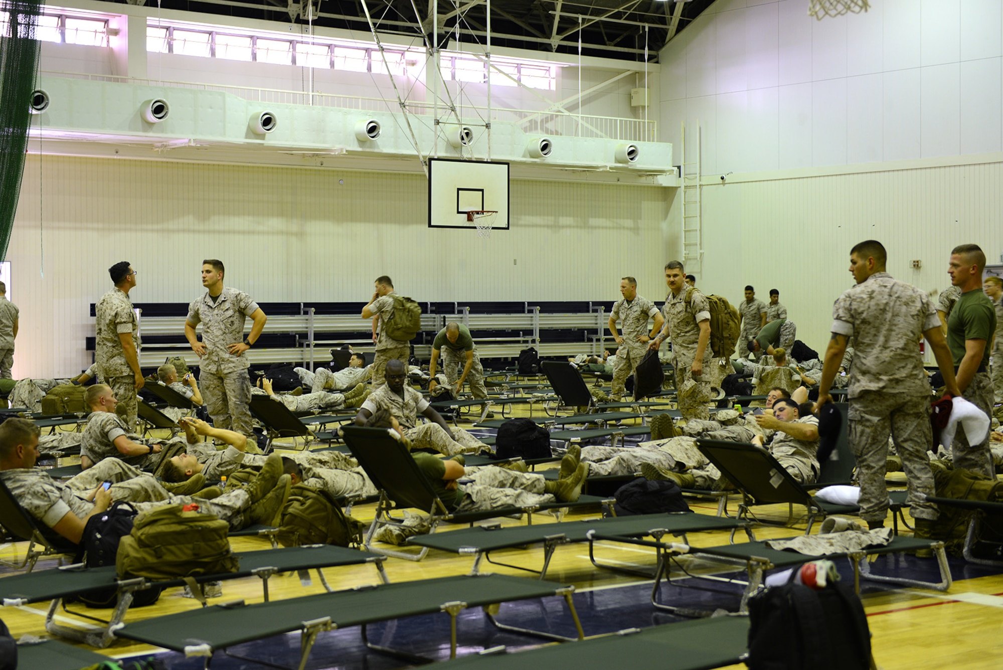 Marines from the Heavy Helicopter Squadron 465, Marine Corps Air Station Miramar, California, gather in the Samurai Fitness Center May 15, 2015, at Yokota Air Base, Japan. The Marines utilized the gym as temporary lodging while their aircraft received required maintenance. (U.S. Air Force photo by Senior Airman Desiree Economides/Released)