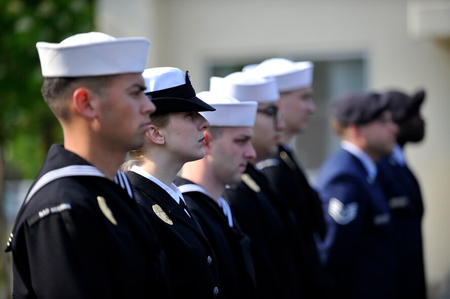 A group of U.S. Navy and Air Force service members take part in a retreat ceremony May 14, 2015, at Misawa Air Base, Japan, which honored law enforcement personnel who sacrificed their lives in the line of duty. The ceremony also included distinguished guests from the Japan Air Self-Defense Force, who came out to support the ceremony as part of Police Week. (U.S. Air Force photo by Senior Airman Jose L. Hernandez-Domitilo/Released)