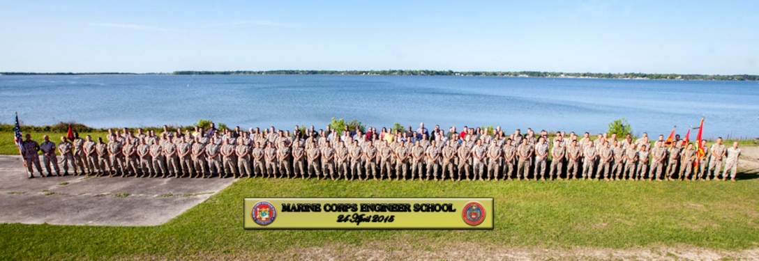 Marines, civilians, and contractors stand for the Marine Corps Engineer School command photograph.