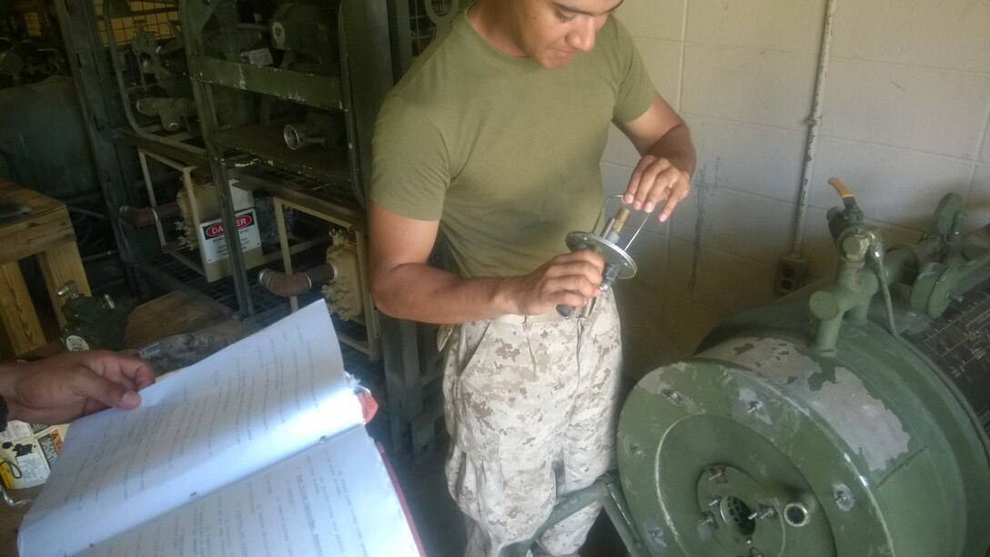 Marines from BWST 6-15 conduct practical application on repairing bare base shower facilities.