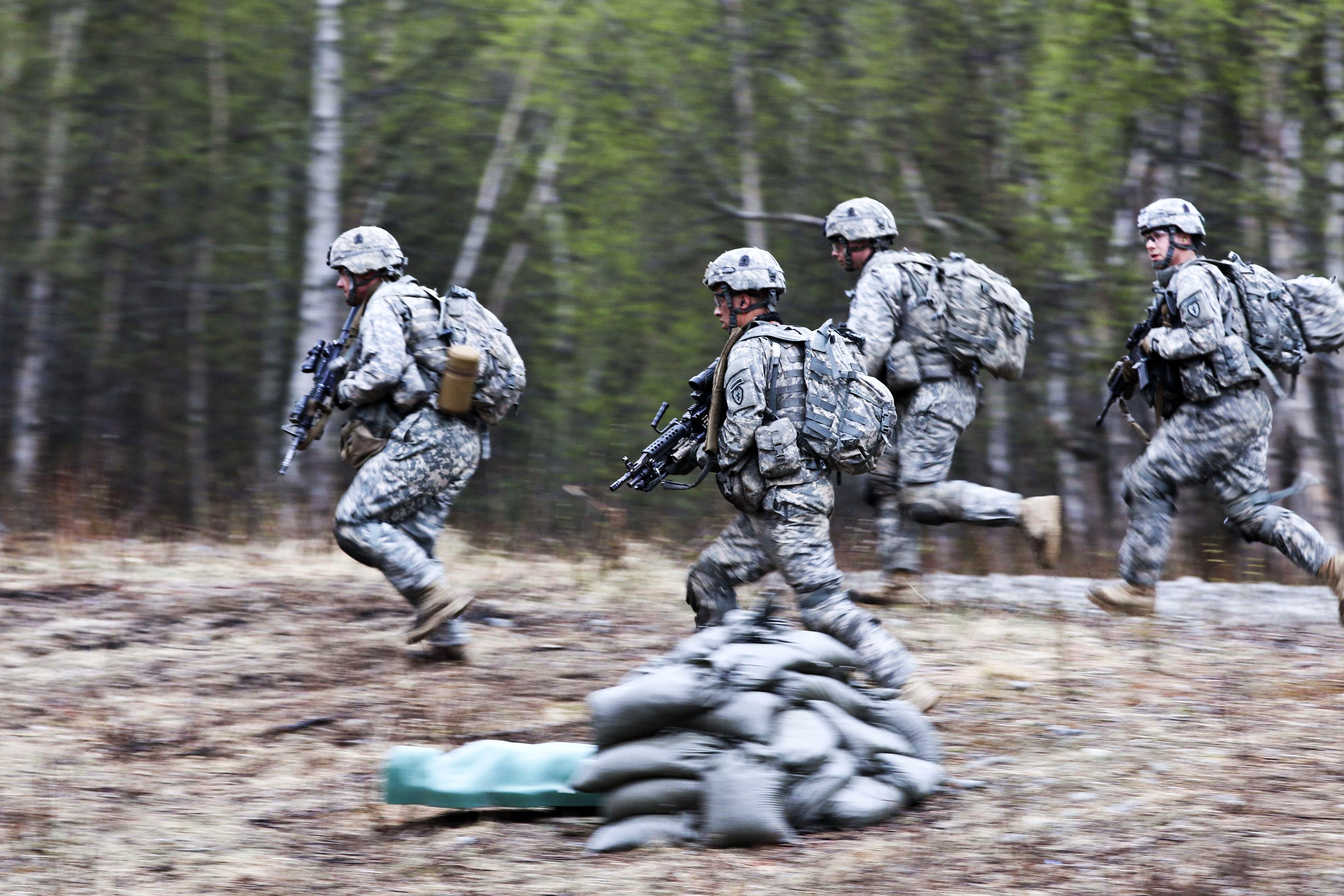 Soldiers charge one of the final objectives during combined arms