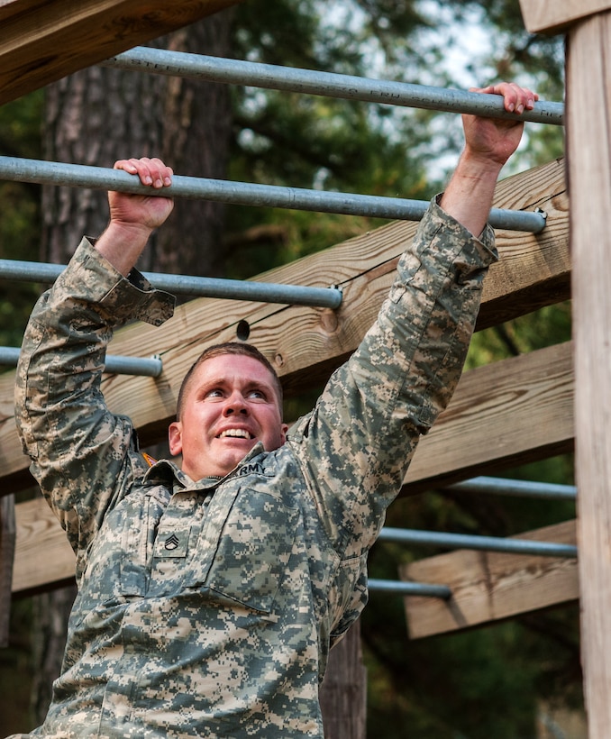 Army Staff Sgt. Zachary Fink traverses the horizontal ladder obstacle during the 2015 U.S. Army Reserve Best Warrior Competition on Fort Bragg, N.C., May 6, 2015. Fink is assigned to the 807th Medical Command, Deployment Support.
