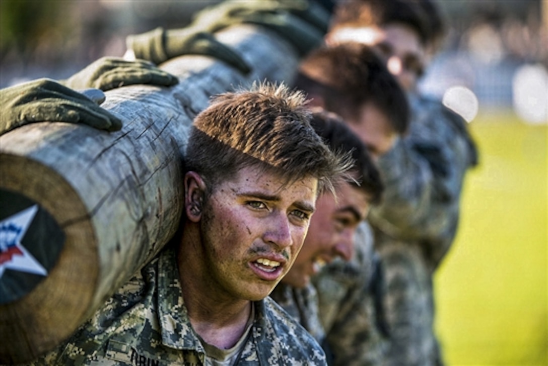 Army Staff Sgt. Josh Tobin and fellow soldiers carry a log on their shoulders during the Gainey Cup competition on Fort Benning, Ga., May 5, 2015. The soldiers are cavalry scouts assigned to the 1st Cavalry Division's 3rd Battalion, 8th Cavalry Regiment, 3rd Armored Brigade Combat Team.