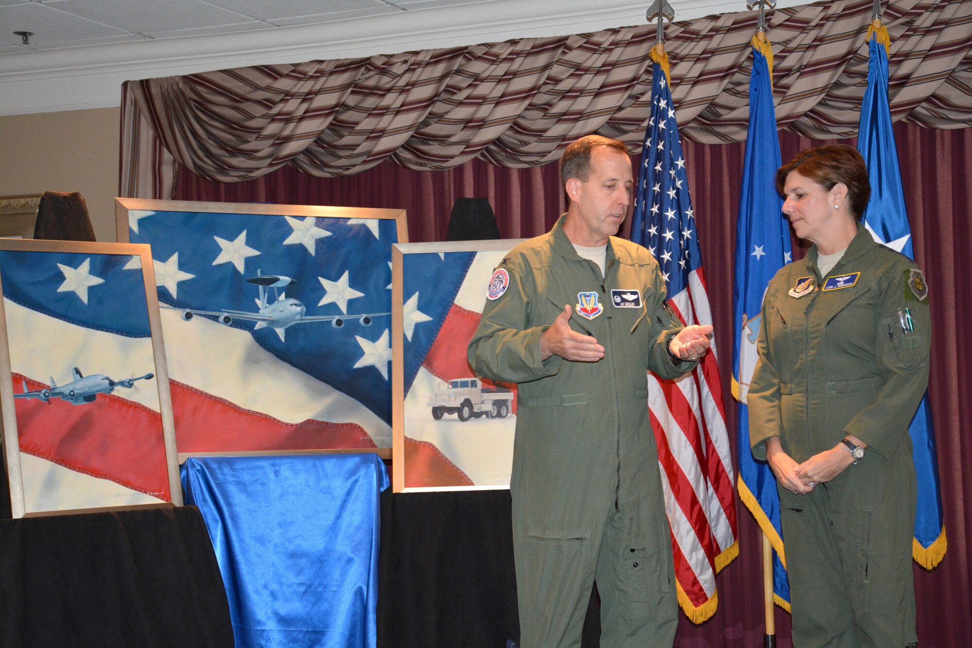 Col. Jay Bickley, commander of the 552nd Air Control Wing at Tinker Air Force Base, thanks Gen. Lori Robinson, commander of Pacific Air Forces, for attending the wing’s Diamond Anniversary kickoff reception May 7 at the Tinker Club. Colonel Bickley presented the general with a commemorative coin. 
(Air Force photo by Darren D. Heusel/Released)