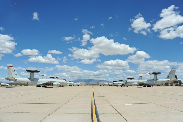 Eight E-3 Airborne Warning and Control System aircraft from Tinker Air Force Base, Okla., sit on a ramp at Davis-Monthan AFB, Ariz., May 16, 2015.  The aircraft arrived here due to tornado alerts in Oklahoma.  (U.S. Air Force photo by Airman 1st Class Chris Massey/Released)