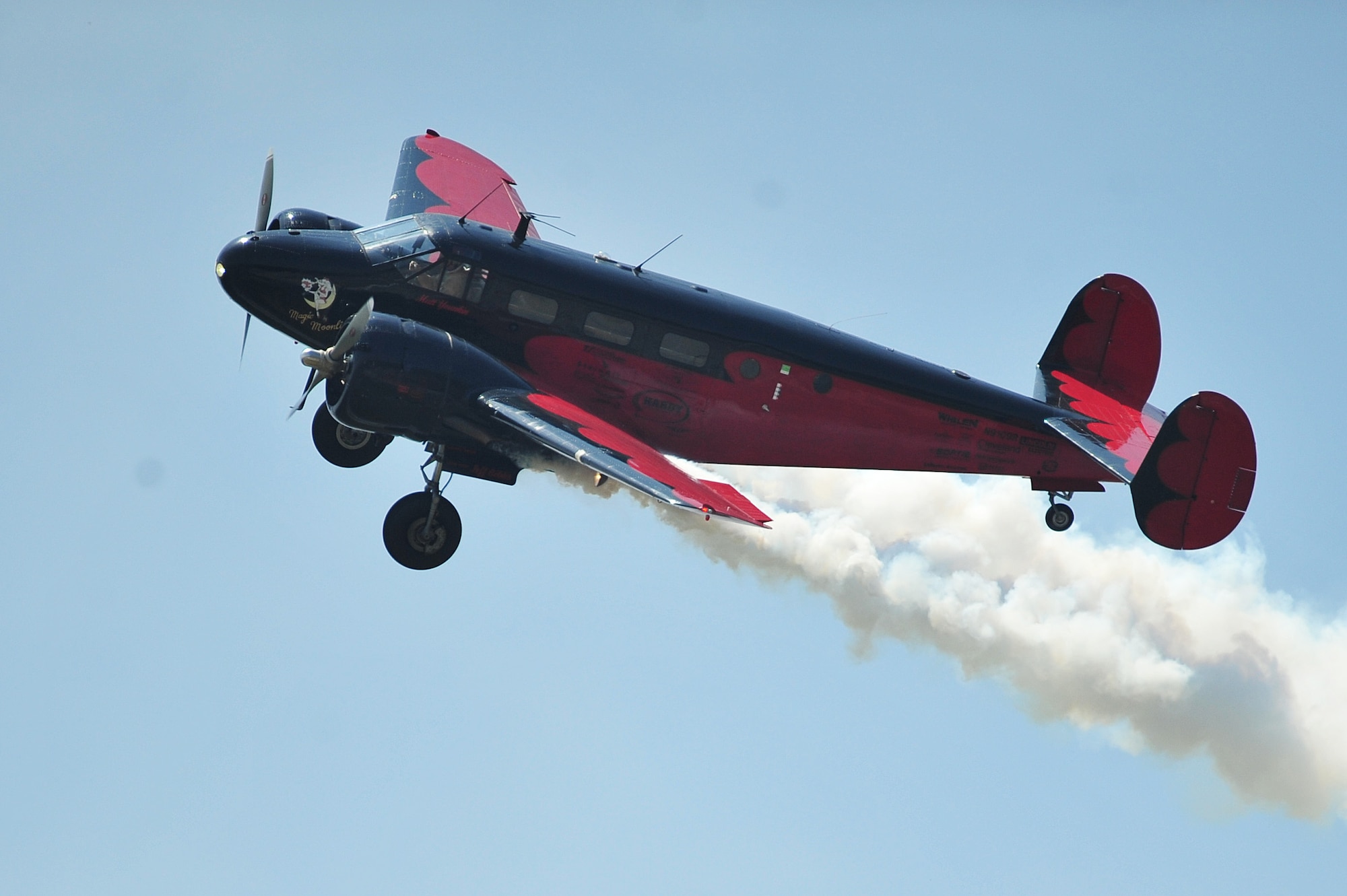 Matt Younkin, aerial performer, shows off his skill in a C-45 during the 2015 Wings Over Wayne Airshow and Open House, May 16, 2015, at Seymour Johnson Air Force Base, North Carolina. Younkin flies more than 80 types of aircraft and has logged more than 3,500 flight hours. (U.S. Air Force photo/Senior Airman John Nieves Camacho)
