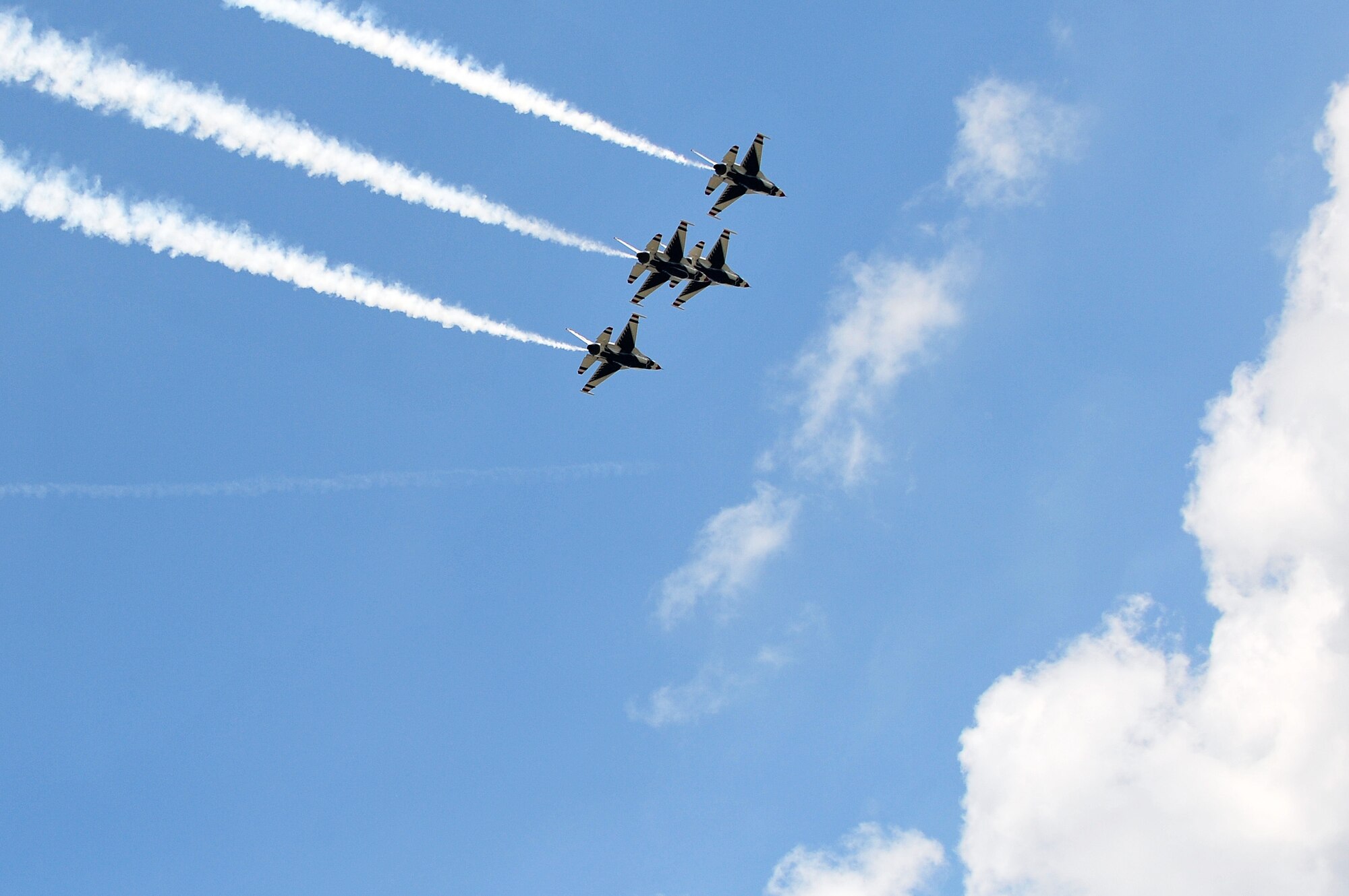 The U.S. Air Force Thunderbirds aerial demonstration team performs a formation maneuver during the 2015 Wings Over Wayne Airshow and Open House, May 16, 2015, at Seymour Johnson Air Force Base, North Carolina. The Thunderbirds aim to strengthen morale and support community relations by executing difficult aerial performances during airshows and other events. (U.S. Air Force photo/Senior Airman John Nieves Camacho)