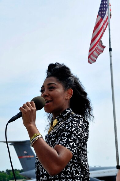 Majesty Rose, former American Idol contestant and local celebrity, sings the National Anthem during the 2015 Wings Over Wayne Airshow and Open House, May 16, 2015, at Seymour Johnson Air Force Base, North Carolina. Majesty and Kellie Pickler, country music artist, were the airshow’s featured entertainment acts. (U.S. Air Force photo/Airman Shawna L. Keyes)