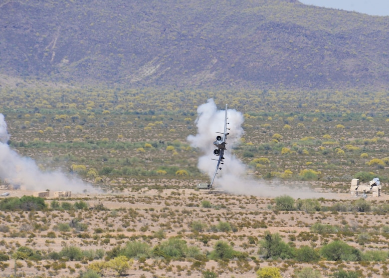 An A-10C Thunderbolt II from the 357th Fighter Squadron turns after completing a strafing run at the Barry M. Goldwater Range, Ariz., April 22, 2015. During the training, the pilots practiced providing close air support for joint terminal attack controllers as well as refining their flying maneuvers in preparation for real world situations.  (U.S. Air Force photo by Airman 1st Class Chris Massey/Released)