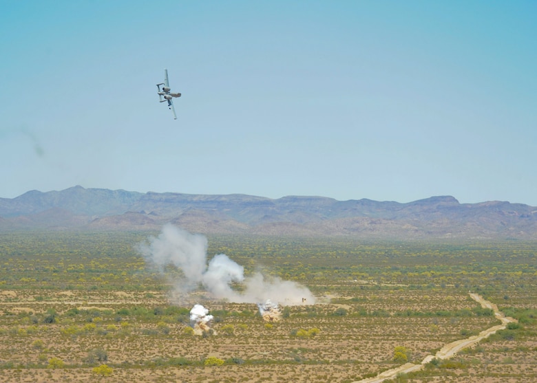 An A-10C Thunderbolt II, 357th Fighter Squadron, practices a strafing run after dropping a BDU-33 at the Barry M. Goldwater Range, Ariz., April 22, 2015.  This training scenario required the A-10 pilots to communicate with a joint terminal attack controller from the 943rd Rescue Group in order to target a specific location.  (U.S. Air Force photo by Airman 1st Class Chris Massey/Released)