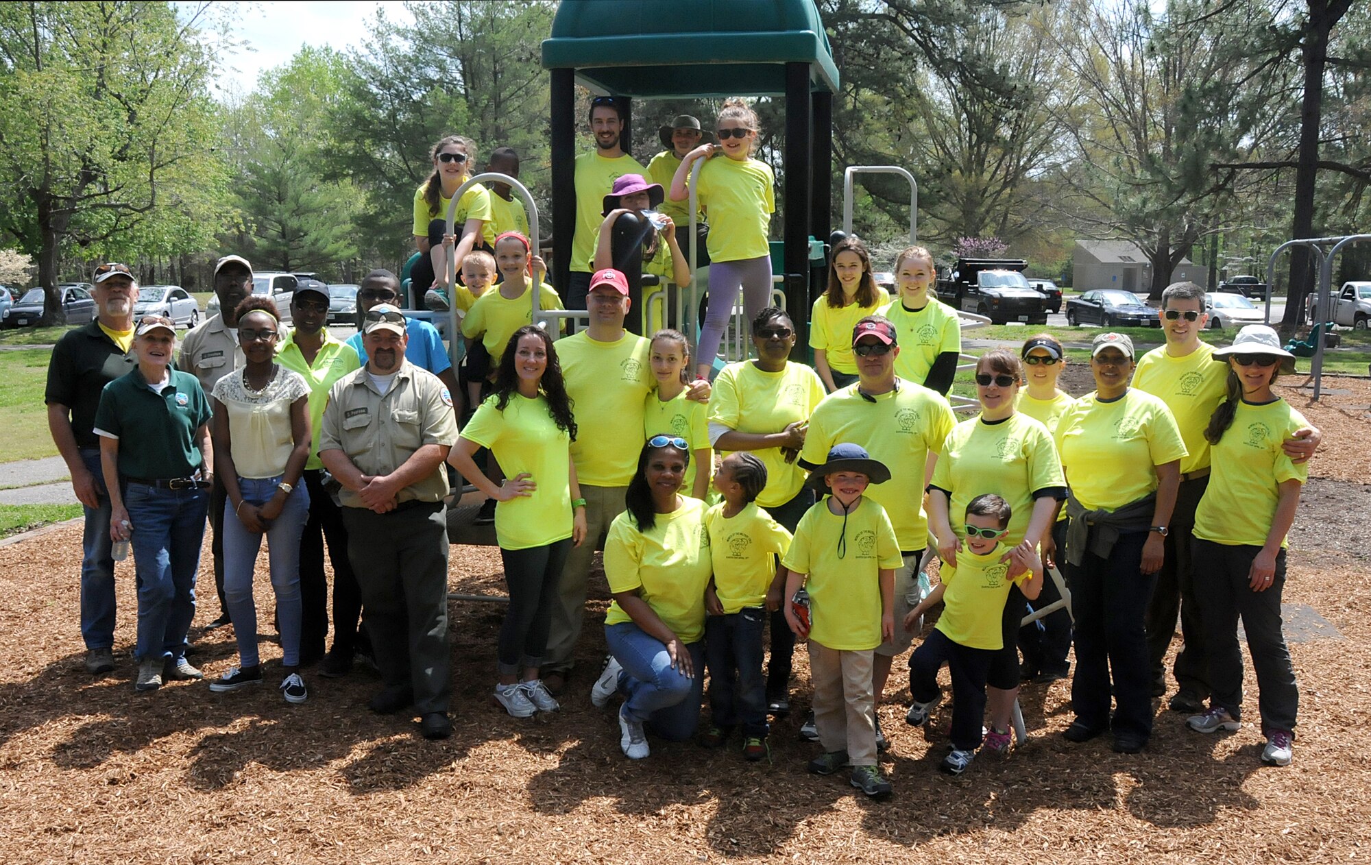 Virginia military members from the 192nd Fighter Wing, 203rd Red Horse Squadron, and the Virginia Army National Guard, and their families volunteered April 18, 2015, to help clean and improve York River State Park in Williamsburg. The families served in honor of the Month of the Military Child as they cleared waste and spread fresh mulch on the playground and around selected trees. (U.S. Air National Guard photo by Airman 1st Class Johnisa B. Roberts/Released)
