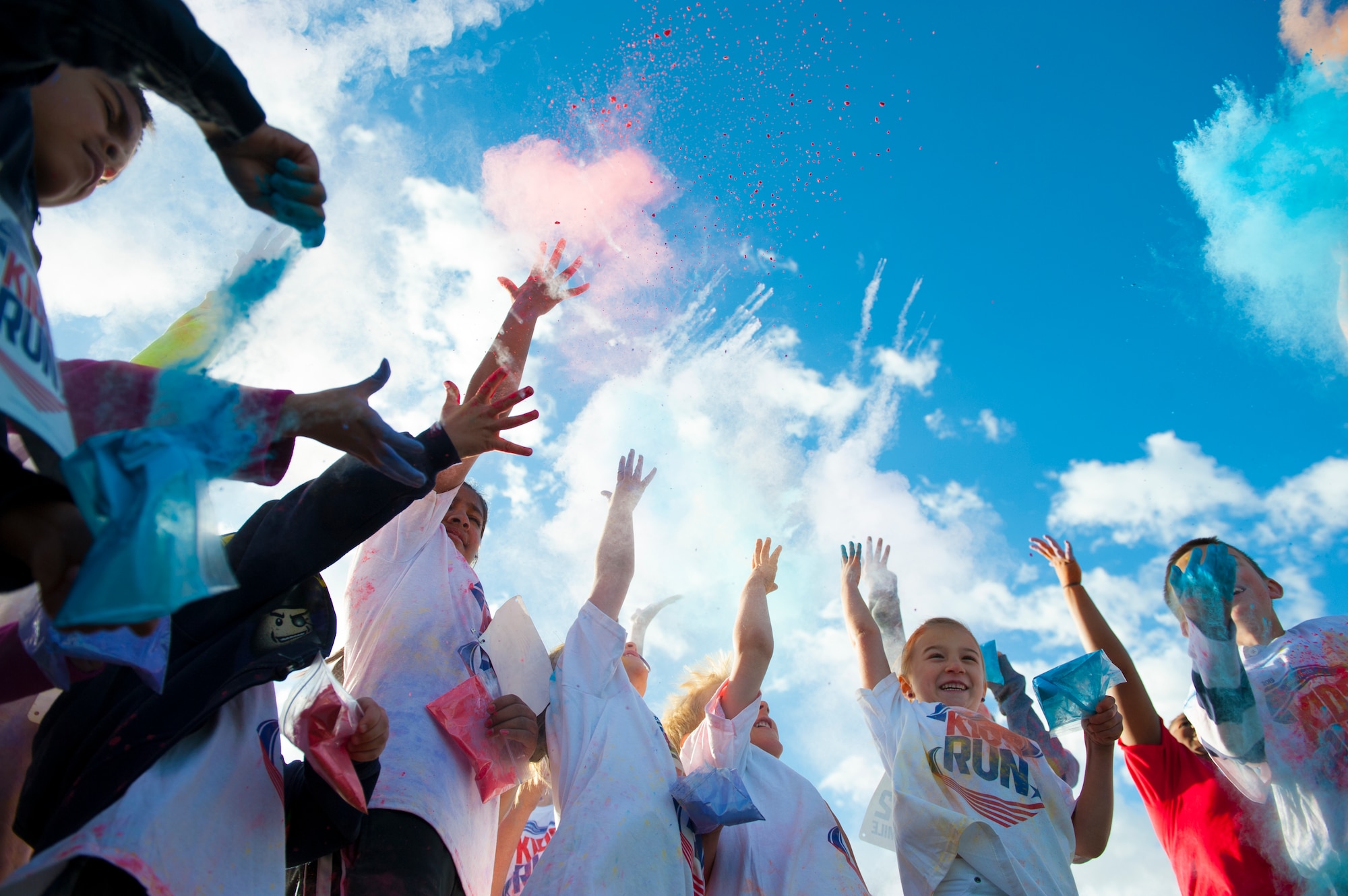 Dependents of Team Holloman members celebrate the completion of America’s Armed Forces Kid Fun Run at Holloman Air Force Base, N.M. May 16, 2015. This event was created for children ages 5 to 13. The younger kids would run 0.5 mile, with the 7 and 8 year olds running 1 mile, and the older kids running 2 miles. (U.S. Air Force photo by Senior Airman Leah Ferrante/Released)