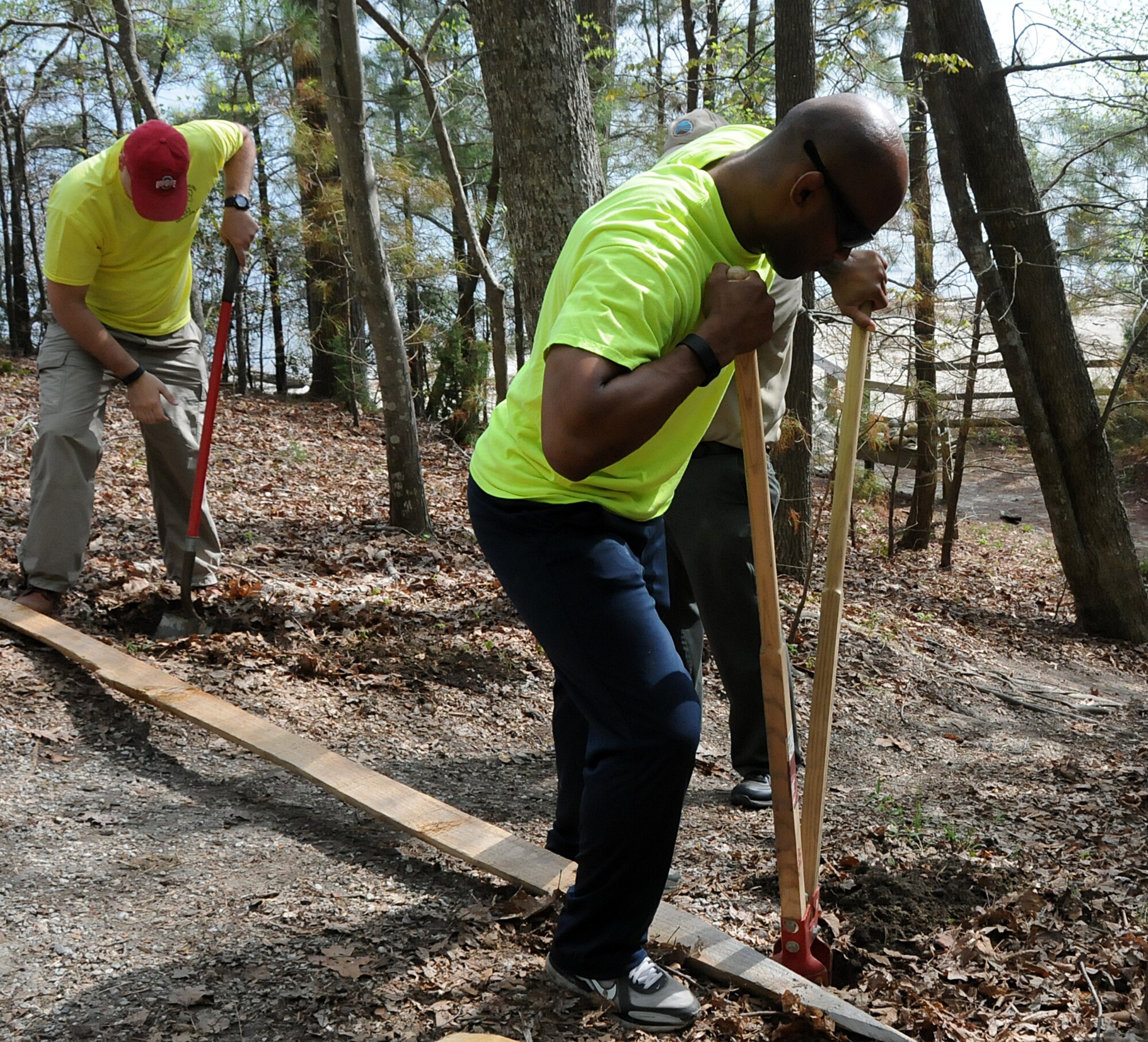 Virginia military members from the 192nd Fighter Wing, 203rd Red Horse Squadron, and the Virginia Army National Guard, and their families volunteered April 18, 2015, to help clean and improve York River State Park in Williamsburg. The families served in honor of the Month of the Military Child as they cleared waste and spread fresh mulch on the playground and around selected trees. (U.S. Air National Guard photo by Airman 1st Class Johnisa B. Roberts/Released)
