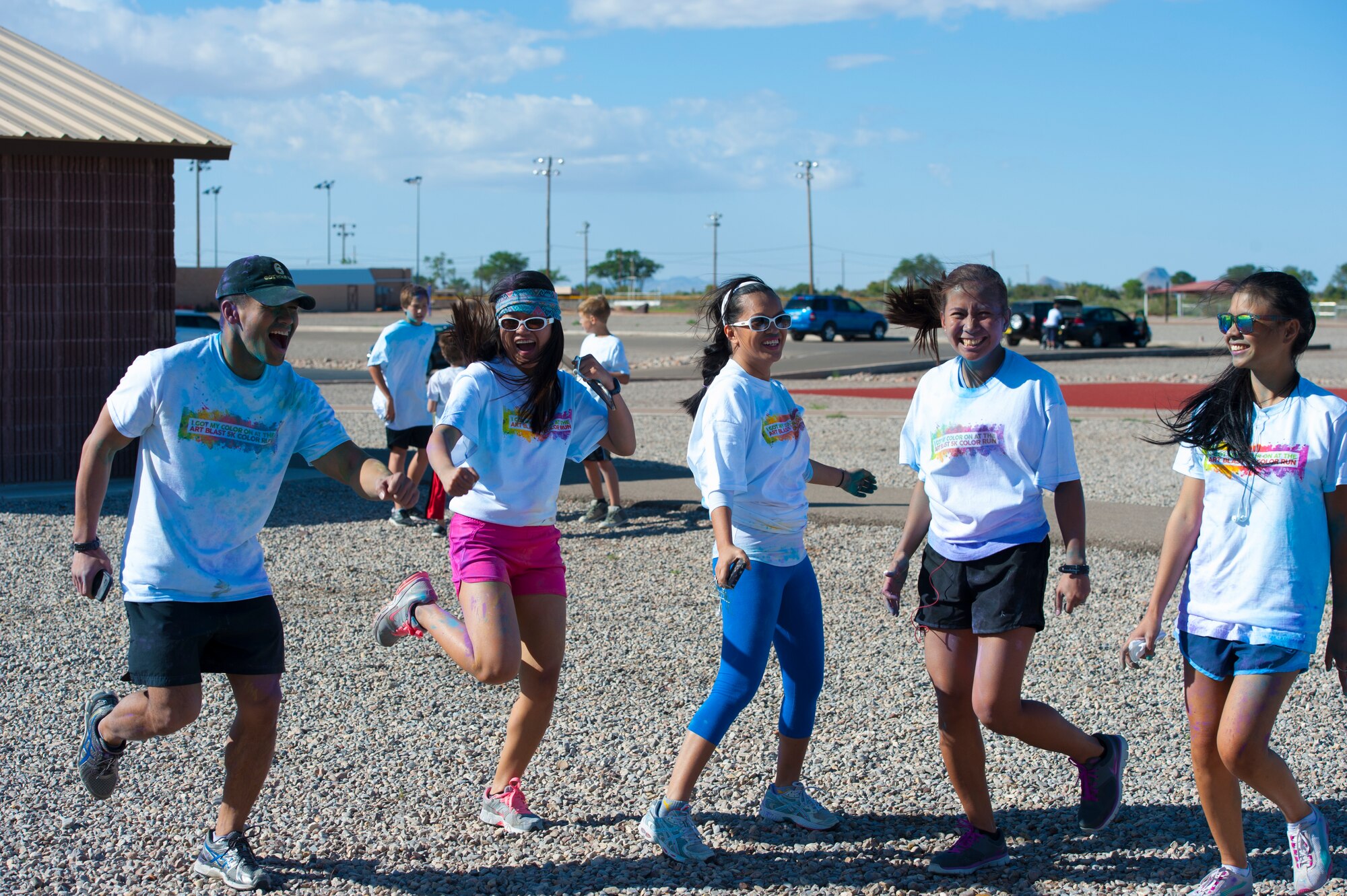 Members of Team Holloman participate in the Art Blast Color 5K Run at Holloman Air Force Base, N.M. May 16, 2015. The Domenici Fitness Center hosts monthly fun runs to help boost morale and get members of Team Holloman enthused about getting and staying fit. (U.S. Air Force photo by Staff Sgt. E’Lysia A. Wray/Released)
