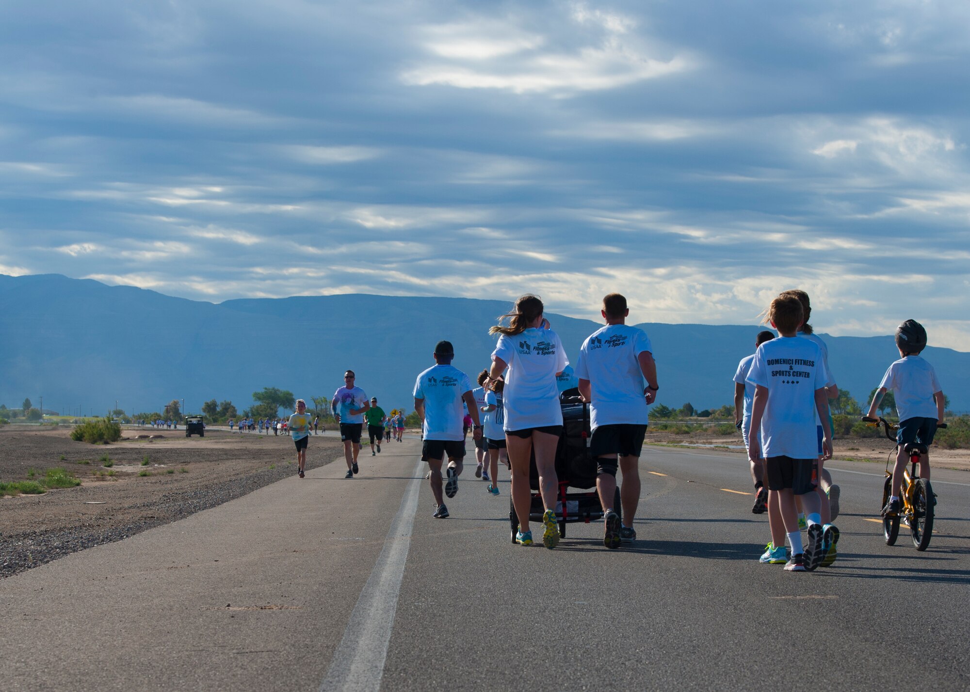 Team Holloman members and their dependents participate in the Art Blast Color 5K Run at Holloman Air Force Base, N.M. May 16, 2015. The Domenici Fitness Center hosts monthly fun runs to help boost morale and get members of Team Holloman enthused about getting and staying fit. (U.S. Air Force photo by Staff Sgt. E’Lysia A. Wray/Released)