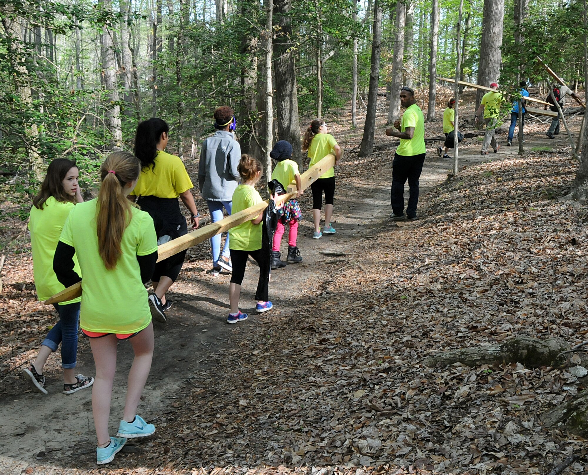 Virginia military members from the 192nd Fighter Wing, 203rd Red Horse Squadron, and the Virginia Army National Guard, and their families volunteered April 18, 2015, to help clean and improve York River State Park in Williamsburg. The families served in honor of the Month of the Military Child as they cleared waste and spread fresh mulch on the playground and around selected trees. (U.S. Air National Guard photo by Airman 1st Class Johnisa B. Roberts/Released)
