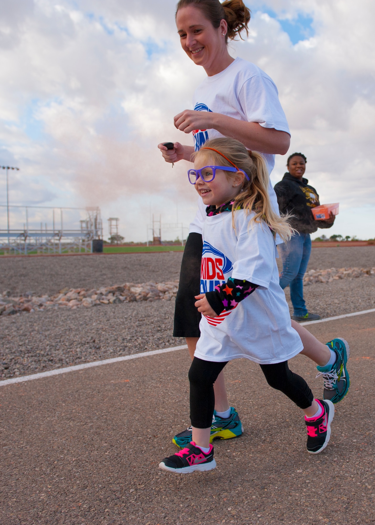 A Team Holloman member and their dependent participate in America’s Armed Forces Kids Fun Run at Holloman Air Force Base, N.M. May 16, 2015. This event was created for children ages 5 to 13. The younger kids would run 0.5 mile, with the 7 and 8 year olds running 1 mile, and the older kids running 2 miles. (U.S. Air Force photo by Senior Airman Leah Ferrante/Released)