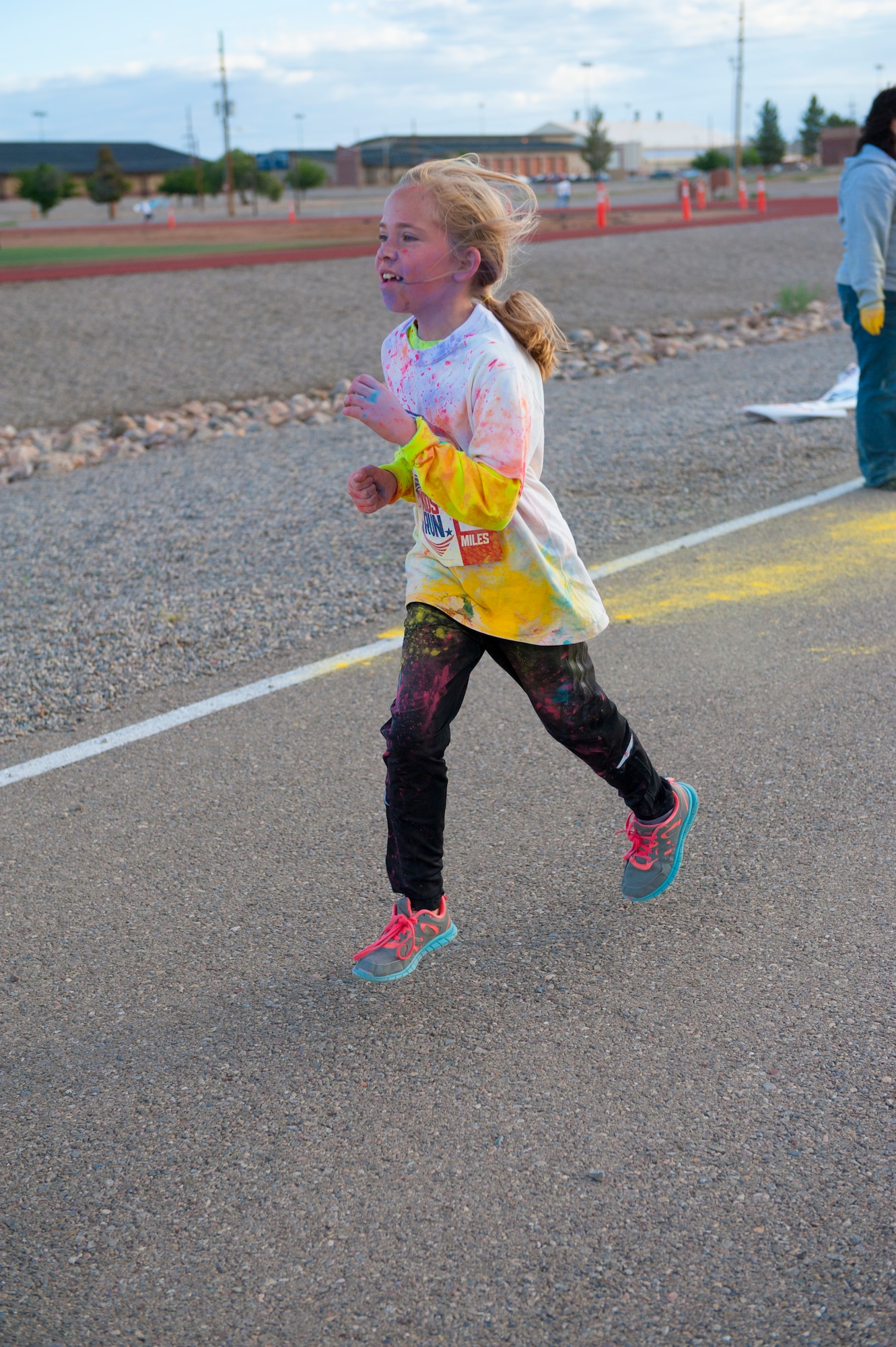 A member of Team Holloman’s dependent participates in America’s Armed Forces Kids Fun Run at Holloman Air Force Base, N.M. May 16, 2015. This event was created for children ages 5 to 13. The younger kids would run 0.5 mile, with the 7 and 8 year olds running 1 mile, and the older kids running 2 miles. (U.S. Air Force photo by Senior Airman Leah Ferrante/Released)
