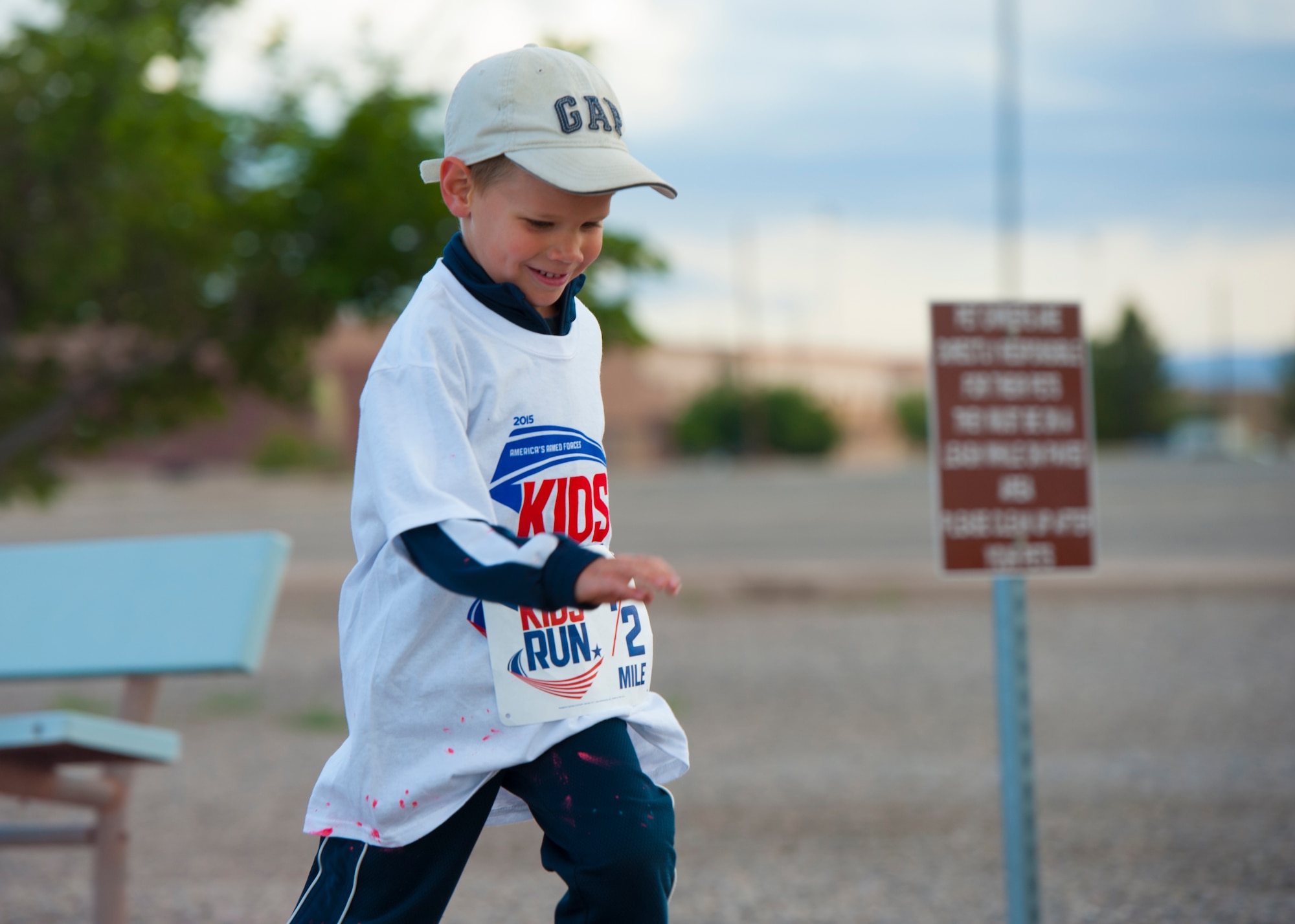 A member of Team Holloman’s dependent participates in America’s Armed Forces Kids Fun Run at Holloman Air Force Base, N.M. May 16, 2015. This event was created for children ages 5 to 13. The younger kids would run 0.5 mile, with the 7 and 8 year olds running 1 mile, and the older kids running 2 miles. (U.S. Air Force photo by Staff Sgt. E’Lysia A. Wray/Released)