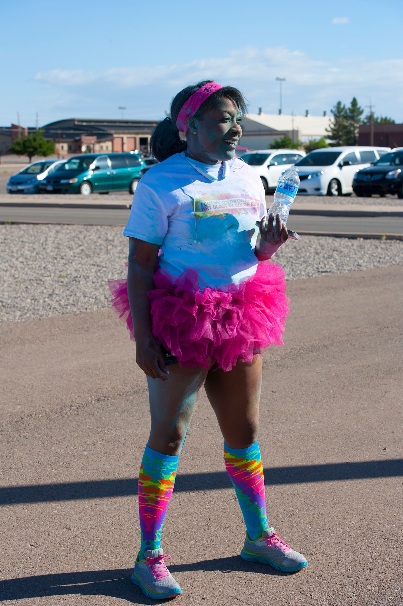 Tech. Sgt. Latoya Hernandez, 49th Operational Group training manager, participates in the Art Blast Color 5K Run at Holloman Air Force Base, N.M. May 16, 2015. The Domenici Fitness Center hosts monthly fun runs to help boost morale and get members of Team Holloman enthused about getting and staying fit. (U.S. Air Force photo by Staff Sgt. E’Lysia A. Wray/Released)