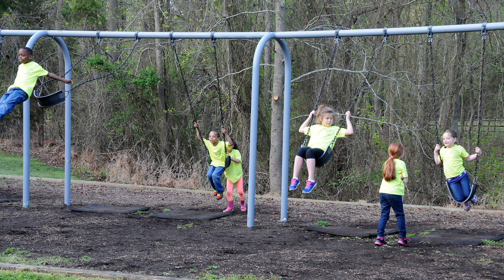 Virginia military members from the 192nd Fighter Wing, 203rd Red Horse Squadron, and the Virginia Army National Guard, and their families volunteered April 18, 2015, to help clean and improve York River State Park in Williamsburg. The families served in honor of the Month of the Military Child as they cleared waste and spread fresh mulch on the playground and around selected trees. (U.S. Air National Guard photo by Airman 1st Class Johnisa B. Roberts/Released)
