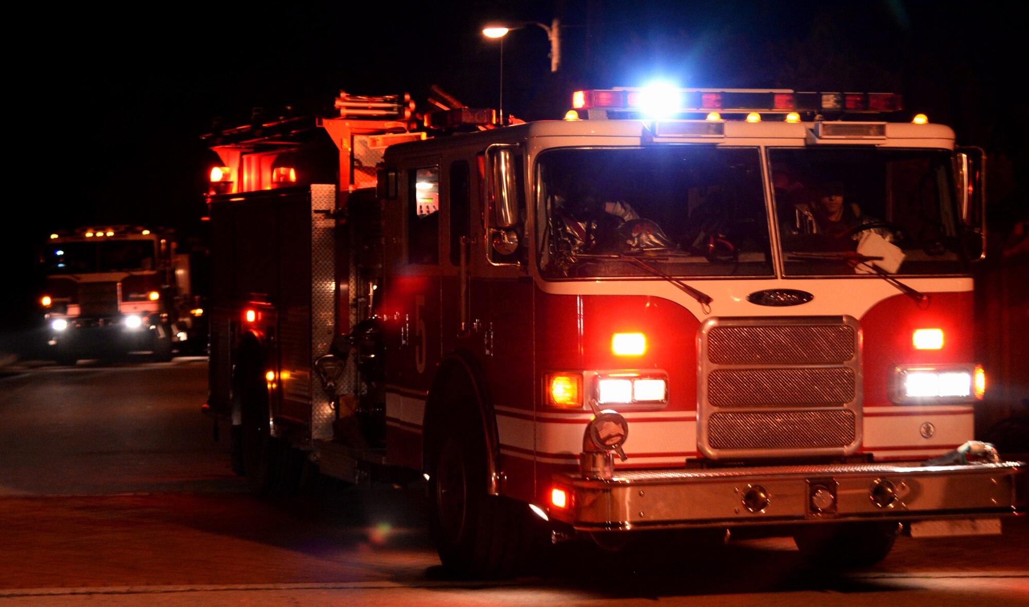 First responders from the 51st Civil Engineer Suqadron arrive on the scene of a simulated mass casualty exercise May 12, 2015, at Osan Air Base, Republic of Korea. The scenario was part of the readiness exercise Beverly Midnight 15-02 and included coordination between multiple agencies across the base. (U.S. Air Force photo by Staff Sgt. Benjamin Sutton/Released)  