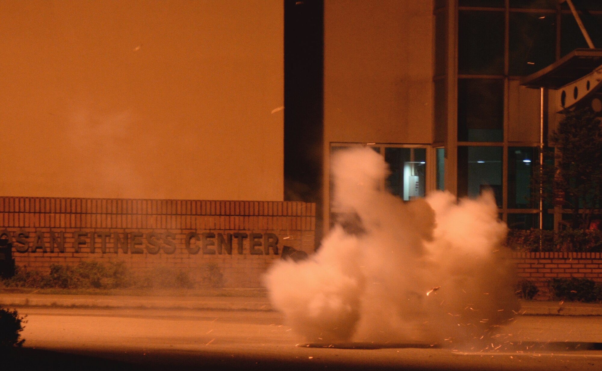 An M115A1 Ground Burst Simulator grenade explodes starting a mass causality exercise May 12, 2015, at Osan Air Base, Republic of Korea. This scenario was part of the readiness exercise Beverly Midnight 15-02. Beverly Midnight tests Osan’s wartime procedures, and realistically looks at our ability to defend the base, execute operations and receive follow-on forces. (U.S. Air Force photo by Staff Sgt. Benjamin Sutton/Released) 