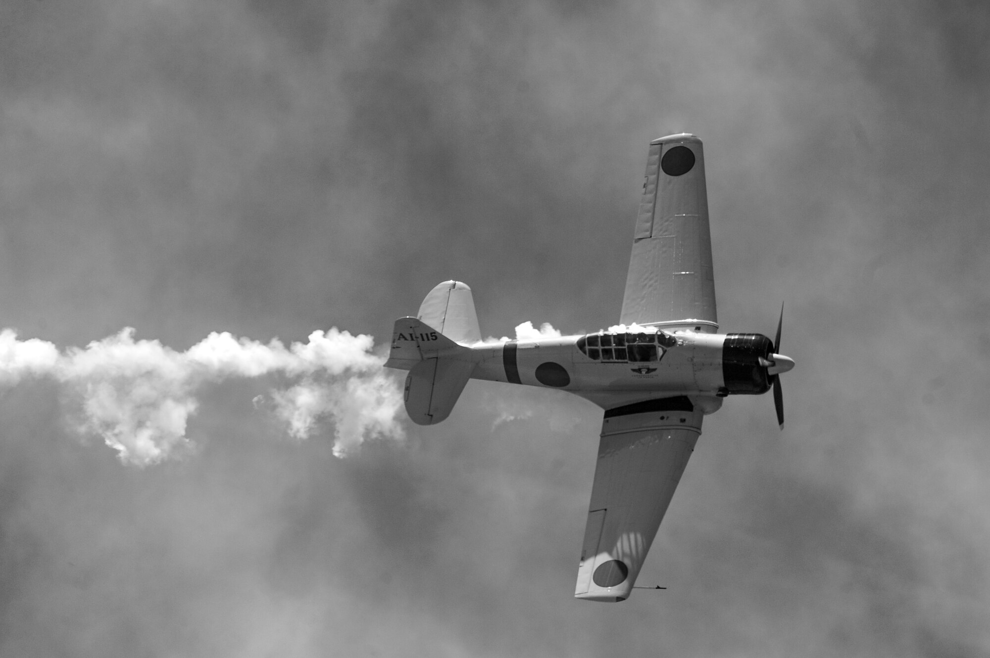 A replica of a Japanese Mitsubishi A6M Zero simulates dropping bombs during the Tora! Tora! Tora! performance as part of the 2015 Wings Over Wayne Air Show, May 17, 2015, at Seymour Johnson Air Force Base, North Carolina. The Tora! Tora! Tora! performance is a reenactment of the events that occurred on December 7, 1941, when the Japanese attacked Pearl Harbor. (U.S. Air Force photo/Senior Airman Brittain Crolley)