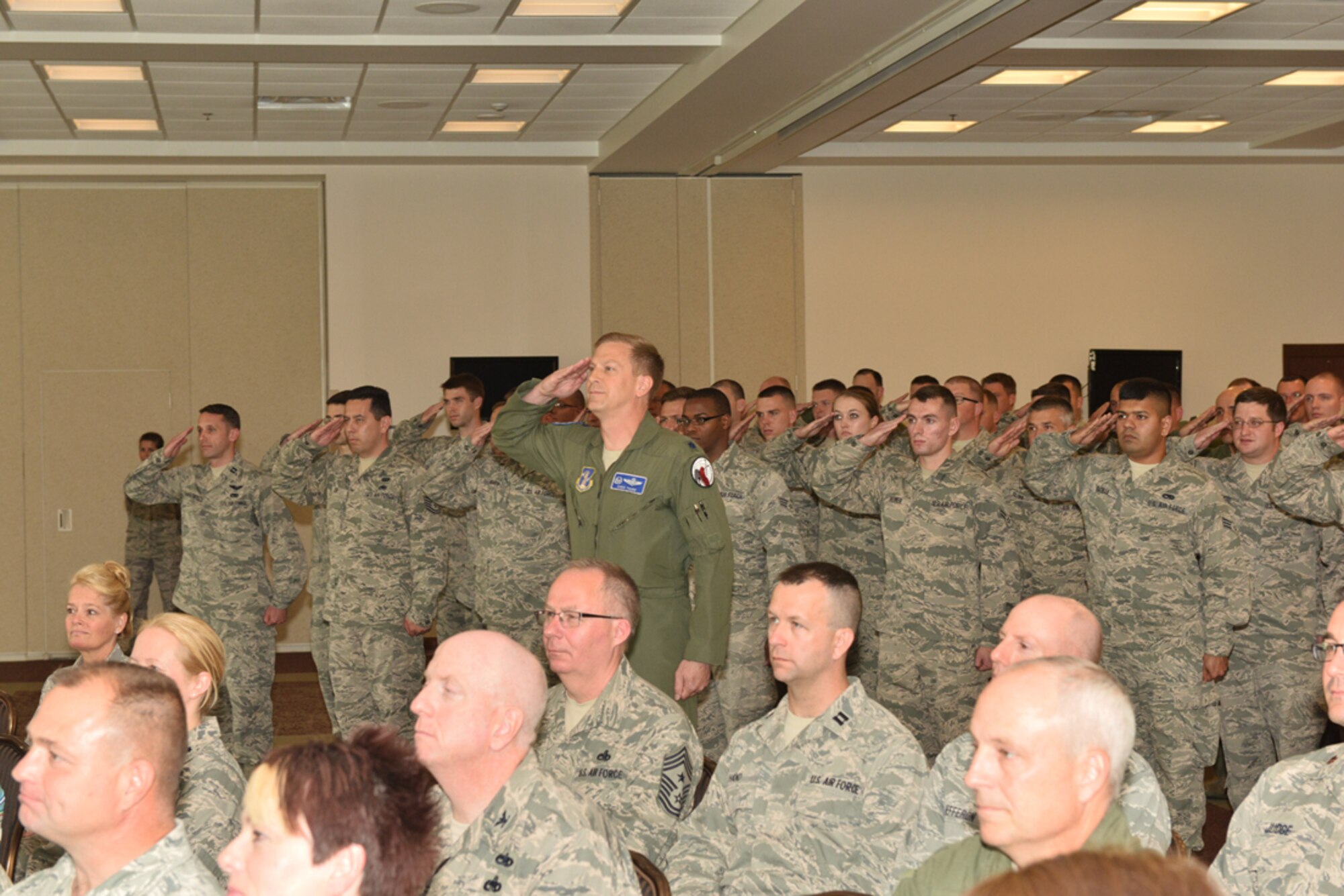 Lt. Col. Chris Thurn, 107th Operations Support Squadron Commander, renders the first salute to Lt. Col. Gary R. Charlton II as commander of the 107th AW Operations Group during a change of command ceremony at Niagara Falls Air Reserve Station, May 16, 2015. 