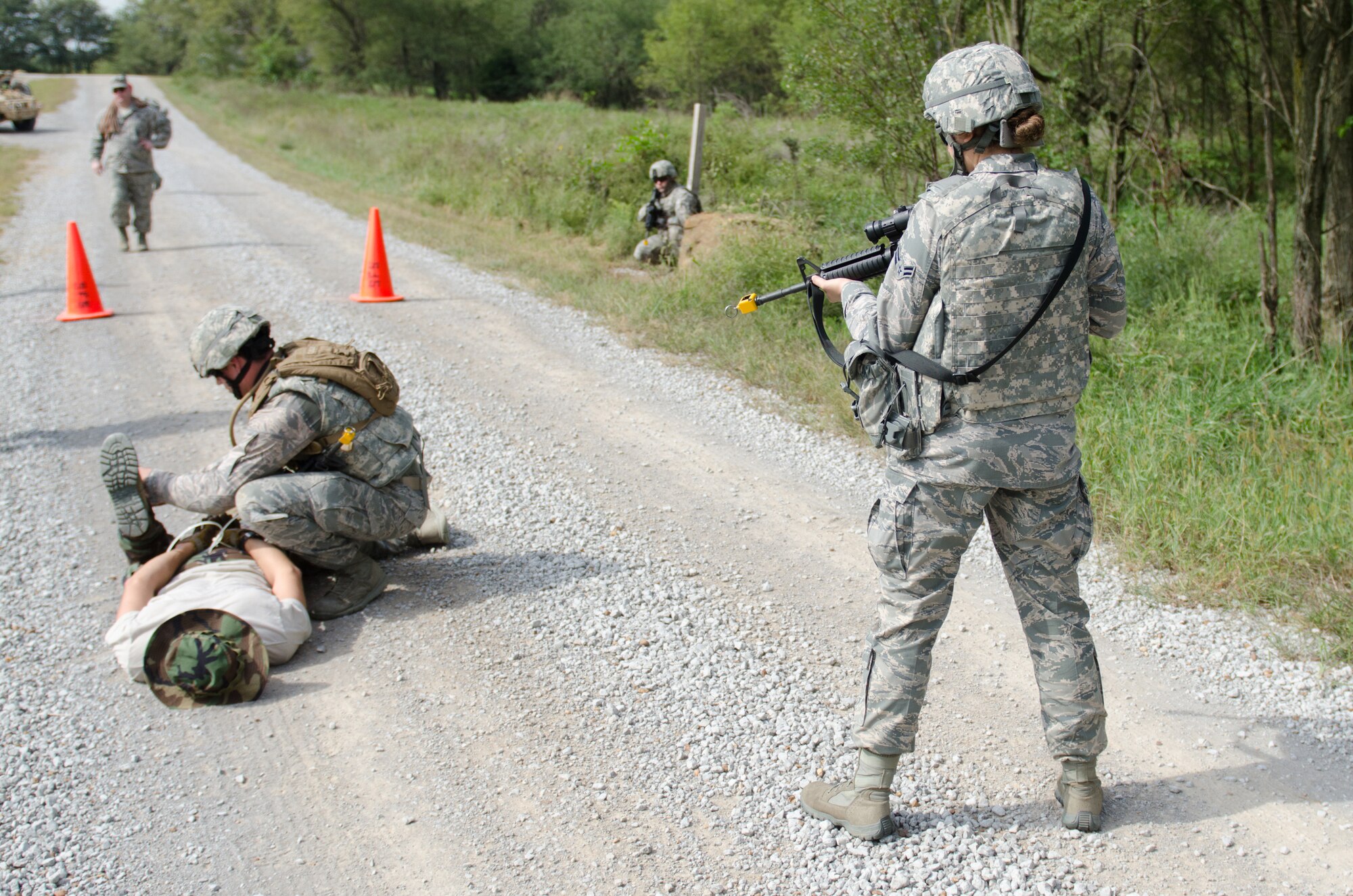 Personnel from the Kentucky Air National Guard’s 123 Security Forces Squadron apprehend a simulated opposing-force actor during a training exercise at the Wendell H. Ford Regional Training Center in Greenville, Ky., on Sept. 18, 2014. The unit’s Airmen conducted a five-day, combat-skills training course to prepare for future deployments. (U.S. Air National Guard photo by Master Sgt. Phil Speck)