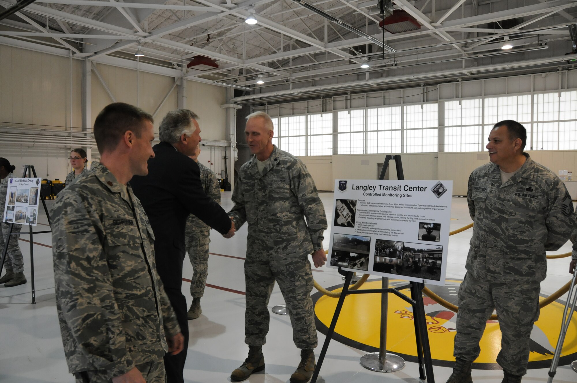 Virginia Gov. Terry McAuliffe greets Lt. Col. Michael Renforth, Virginia Air National Guard’s 192D Fighter Wing, during a visit to Langley Air Force Base, Va., Dec. 2, 2014. McAuliffe, the 72nd governor of Virginia, spoke with Airmen to understand their involvement in maintaining the mission capabilities of the installation. 