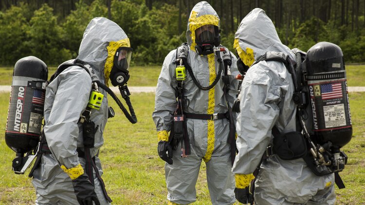 Explosive ordnance disposal technicians with 2nd EOD Company, 8th Engineer Support Battalion, prepare to conduct a chemical, biological, radiological, and nuclear training operation during their pre-deployment training aboard Marine Corps Base Camp Lejeune, North Carolina, May 6, 2015. During the scenario, the Marines had to conduct reconnaissance on an explosive device, identify the agent in the device and defuse it before it detonated.