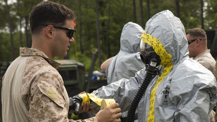 Explosive ordnance disposal technicians with 2nd EOD Company, 8th Engineer Support Battalion, prepare to conduct a chemical, biological, radiological, and nuclear training operation during their pre-deployment training aboard Marine Corps Base Camp Lejeune, North Carolina, May 6, 2015. During the scenario, the Marines had to conduct reconnaissance on an explosive device, identify the agent in the device, and defuse it before it detonated.
