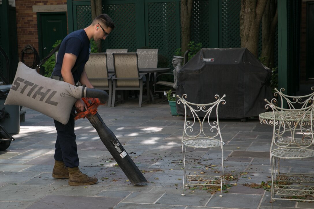 Cpl. Kyle Trajkovski, Grounds Platoon, Headquarters and Service Company, operates a lawn vacuum in the Marine and Family garden at the Home of the Commandants', Marine Barracks Washington, D.C. May 13, 2015. (U.S. Marine Corps photo by Cpl. Christian Varney/ Released)