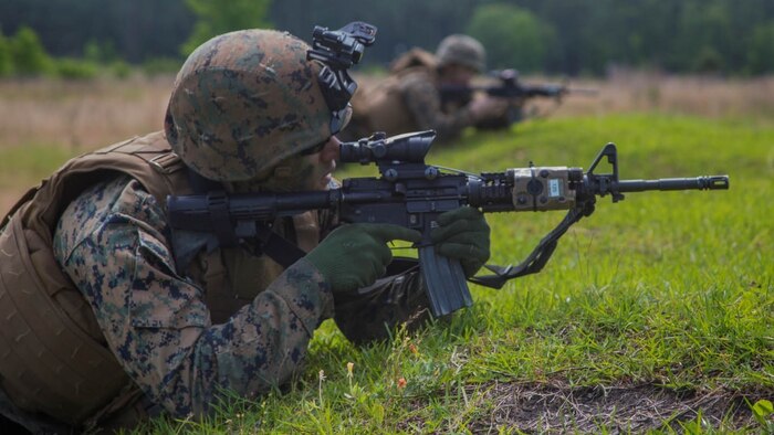 A Marine with 2nd Ground Sensor Platoon, 2nd Intelligence Battalion sights in on targets during a live fire range aboard Camp Lejeune, N.C., May 14, 2015. Marines with the platoon conducted fire-team competitions, fire-team rushes, and squad rushes at range K-509 to touch up on proficiency in infantry tactics.