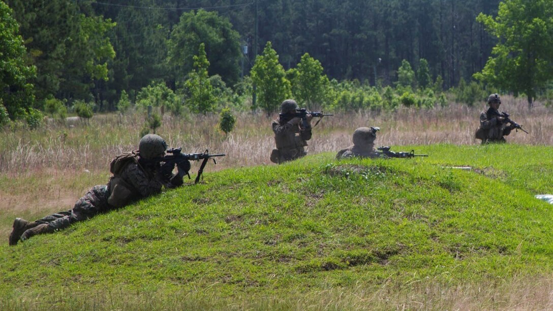 Marines with 2nd Ground Sensor Platoon, 2nd Intelligence Battalion suppress the enemy before advancing forward during a fire-team rush aboard Camp Lejeune, N.C., May 13, 2015. Marines with the platoon conducted a live-fire range where the Marines were tested in their ability to efficiently conduct fire-team and squad-size rushes while engaging the enemy.