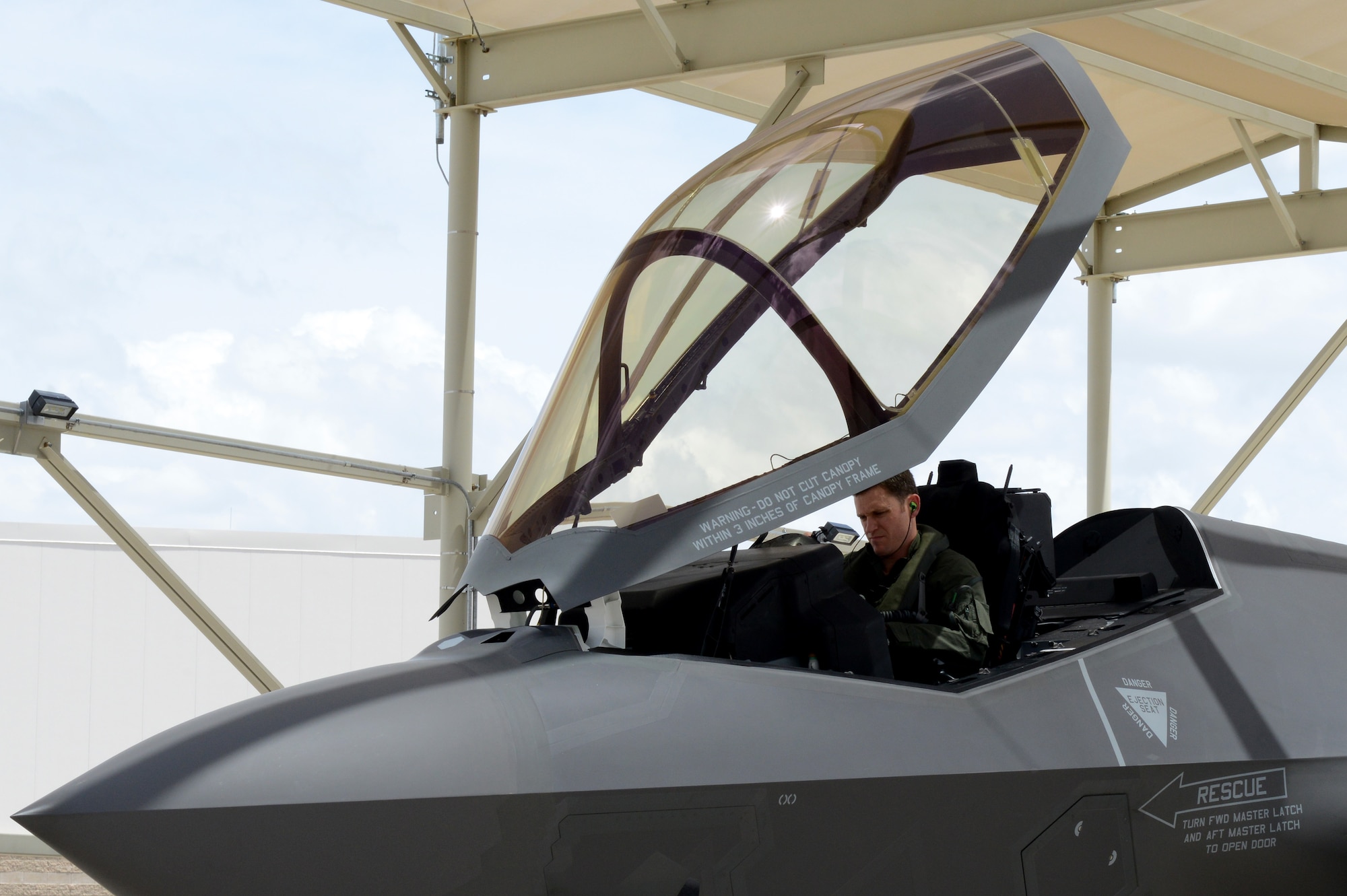 Royal Australian Air Force Maj. Andrew Jackson, 61st Fighter Squadron RAAF squadron leader, performs pre-flight checks in a RAAF F-35 A Lightning II at Luke Air Force Base, Arizona, May 14, 2015. Pre-flight checks help ensure the aircraft is fit and flight ready. Jackson was the first Australian pilot to fly the RAAF F-35 at Luke. (U.S. Air Force photo by Senior Airman James Hensley)