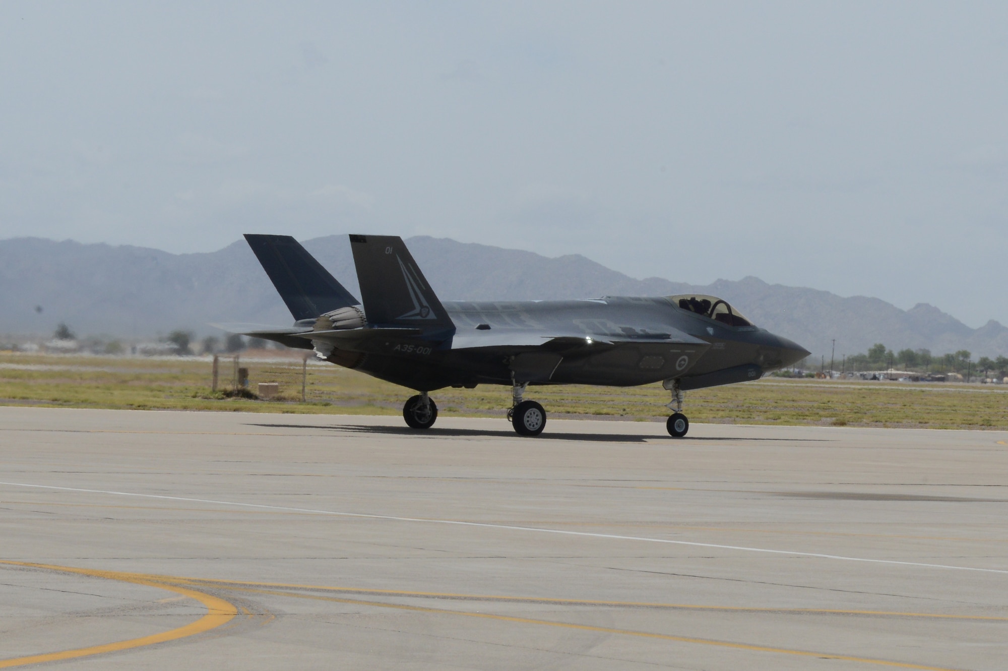 Royal Australian Air Force Maj. Andrew Jackson, 61st Fighter Squadron RAAF squadron leader, taxis out to the runway at Luke Air Force Base, Arizona, May 14, 2015. This flight marks the first F-35 sortie for the RAAF. (U.S. Air Force photo by Senior Airman James Hensley) 