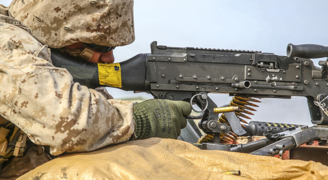 Lance Cpl. Brian Bowser, an administrative specialist with the 13th Marine Expeditionary Unit, fires an M240B Light Machine Gun aboard Camp Pendleton, Calif., during weapons familiarization portion of the MEUs Command Post Exercise 1, May 14, 2015. The exercise served to test the unit's command and control ability as well as satisfy annual training requirements.