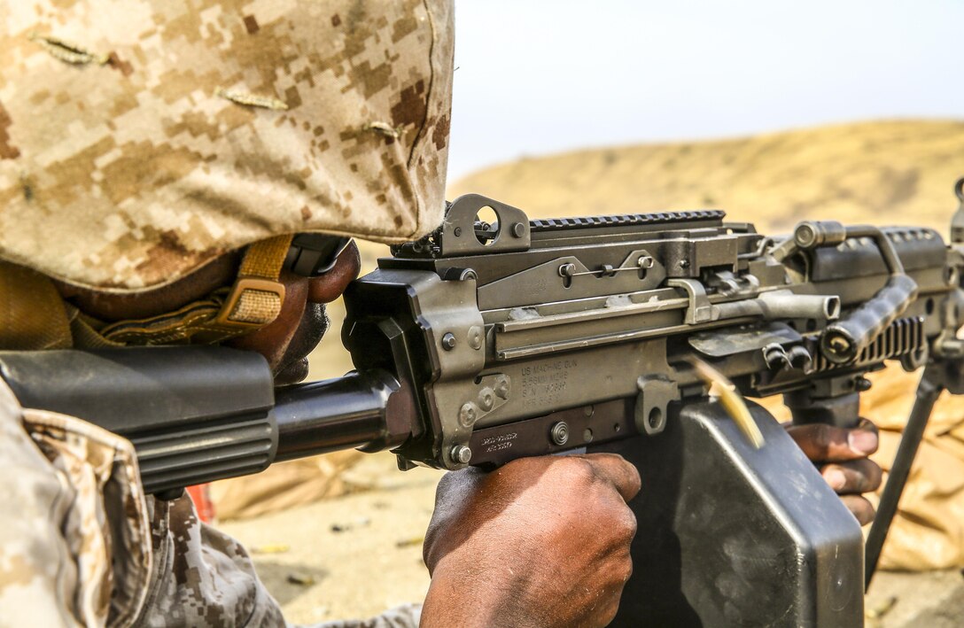 Sgt. Keysean Chavers, an ammunition technician with the 13th Marine Expeditionary Unit, fires an M249 Squad Automatic Weapon aboard Camp Pendleton, Calif., during weapons familiarization portion of the MEUs Command Post Exercise 1, May 14, 2015. The exercise served to test the unit's command and control ability as well as satisfy annual training requirements.
