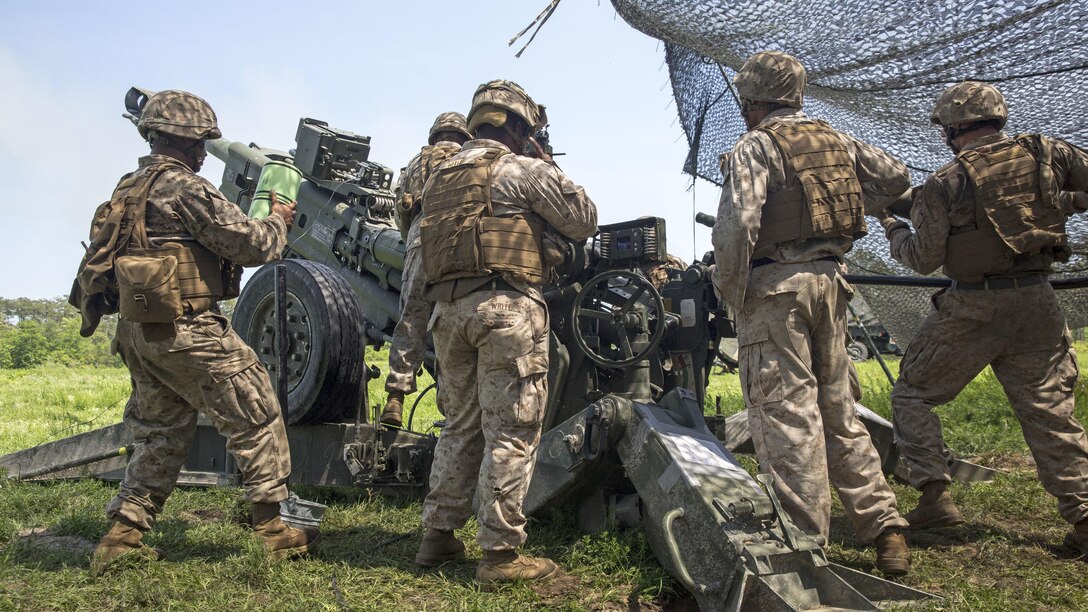 Artillerymen with Combined Arms Company Artillery Platoon, 3rd Battalion, 8th Marine Regiment load an M777A2 Howitzer during a week-long training exercise at Marine Corps Base Camp Lejeune, North Carolina, May 11-15. The newly formed unit made up of Marines from Bravo and Charlie Batteries, 1st Battalion, 10th Marine Regiment tested their teamwork and versatility during the exercise, which is part of their preparation for an upcoming deployment in support of the Black Sea Rotational Force based in Romania.