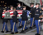 The New York National Guard's Honor Guard team conduct an honorable remains transfer from a Minnesota Air National Guard C-130 Hercules at the 2010 Army National Guard's Honor Guard competition at Fort Snelling, Minn., Sept. 22.