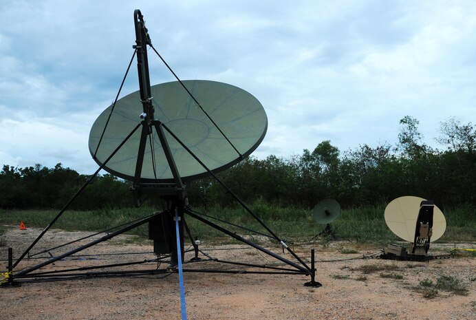 In this photo, deployable Joint Command and Control satellites send and receive communications information at the Joint Task Force 505 Intermediate Staging Base, Utapao Royal Thai Naval Airfield, Thailand, May 12. The satellite are part of the DJC2 system which is currently providing communications capability. DJC2 integrates software, hardware and processes to support a shared-information environment consisting of joint, coalition, multinational and nongovernmental agencies, and has proved to be an important communications tool during Operation Sahayogi Haat. 