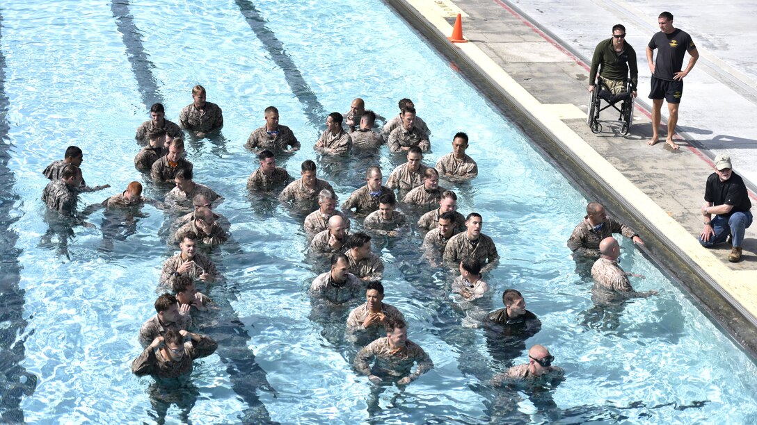 Reconnaissance Marines prepare to qualify to compete in the Recon Challenge at Marine Corps Base Camp Pendleton, California, May 14, 2015. The Recon Challenge is an annual competition of grueling tests, hosted by the Reconnaissance Training Company, Advanced Infantry Training Battalion, School of Infantry West, and conducted by volunteers from the recon community in honor of reconnaissance Marines and sailors killed in action. The challenge consisted of a 1000-meter swim with fins in the Pacific Ocean followed by an observation and memorization game, a navigation and map work test, radio and communication test, obstacle course event, weapon assembly and disassembly test, two pool challenges, fireman’s carry event, live-fire range and a knot -tying test scattered along the route to the finish line.
