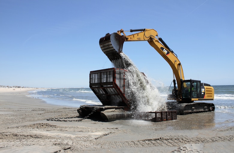 The U.S. Army Corps of Engineers and its contractor Great Lakes Dredge and Dock Company rinse a screening basket after pumping sand onto Ocean City as part of the Great Egg Harbor Inlet to Townsends Inlet coastal storm damage reduction project. 