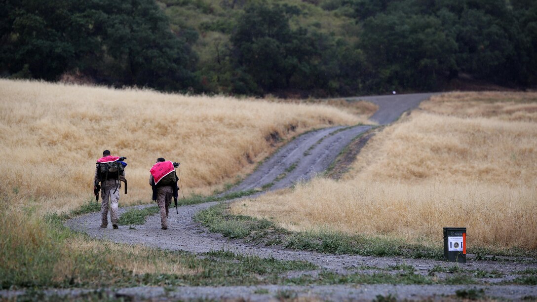 Reconnaissance Marines hike to their next obstacle during the Recon Challenge at Marine Corps Base Camp Pendleton, California, May 15, 2015. The Recon Challenge is an annual competition of grueling tests, hosted by the Reconnaissance Training Company, Advanced Infantry Training Battalion, School of Infantry West, and conducted by volunteers from the recon community in honor of reconnaissance Marines and sailors killed in action. The challenge consisted of a 1000-meter swim with fins in the Pacific Ocean followed by an observation and memorization game, a navigation and map work test, radio and communication test, obstacle course event, weapon assembly and disassembly test, two pool challenges, fireman’s carry event, live-fire range and a knot-tying test scattered along the route to the finish line. 