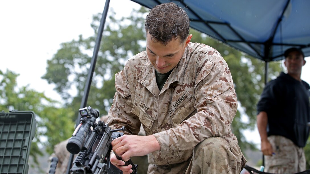 A reconnaissance Marine disassembles an M4 assault rifle during the Recon Challenge at Marine Corps Base Camp Pendleton, California, May 15, 2015. The Recon Challenge is an annual competition of grueling tests, hosted by the Reconnaissance Training Company, Advanced Infantry Training Battalion, School of Infantry West, and conducted by volunteers from the recon community in honor of reconnaissance Marines and sailors killed in action. The challenge consisted of a 1000-meter swim with fins in the Pacific Ocean followed by an observation and memorization game, a navigation and map work test, radio and communication test, obstacle course event, weapon assembly and disassembly test, two pool challenges, fireman’s carry event, live-fire range and a knot-tying test scattered along the route to the finish line.