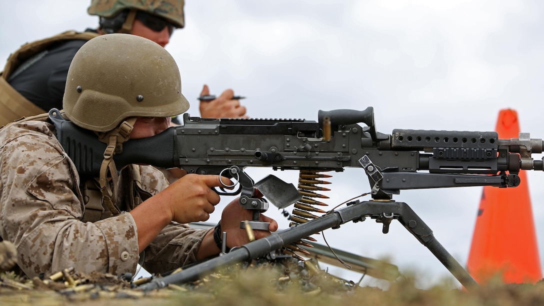 A reconnaissance Marine fires an M240B machine gun during the Recon Challenge at Marine Corps Base Camp Pendleton, California, May 15, 2015. The Recon Challenge is an annual competition of grueling tests, hosted by the Reconnaissance Training Company, Advanced Infantry Training Battalion, School of Infantry West, and conducted by volunteers from the recon community in honor of reconnaissance Marines and sailors killed in action. The challenge consisted of a 1000-meter swim with fins in the Pacific Ocean followed by an observation and memorization game, a navigation and map work test, radio and communication test, obstacle course event, weapon assembly and disassembly test, two pool challenges, fireman’s carry event, live-fire range and a knot-tying test scattered along the route to the finish line.